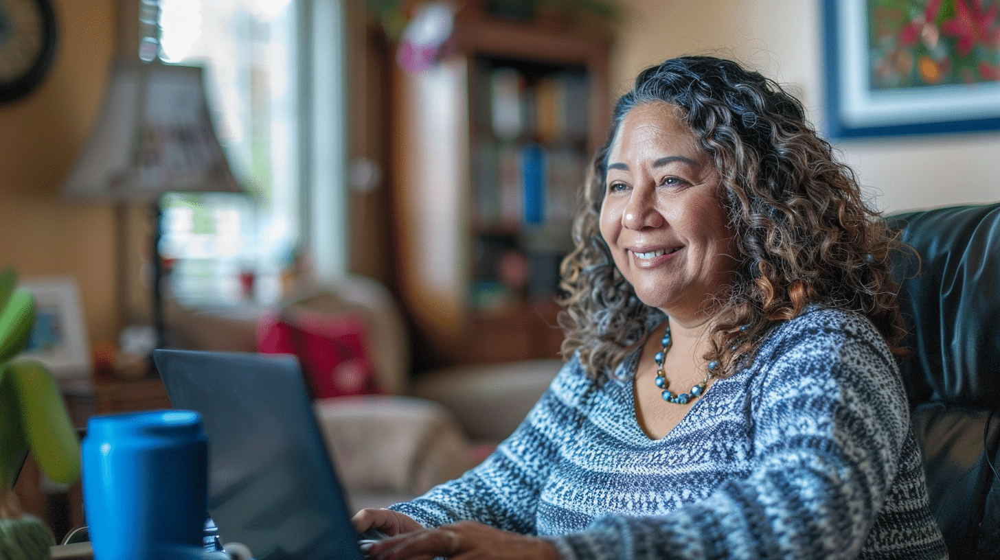 Hispanic woman in her 50s at home during a telemedicine appointment.