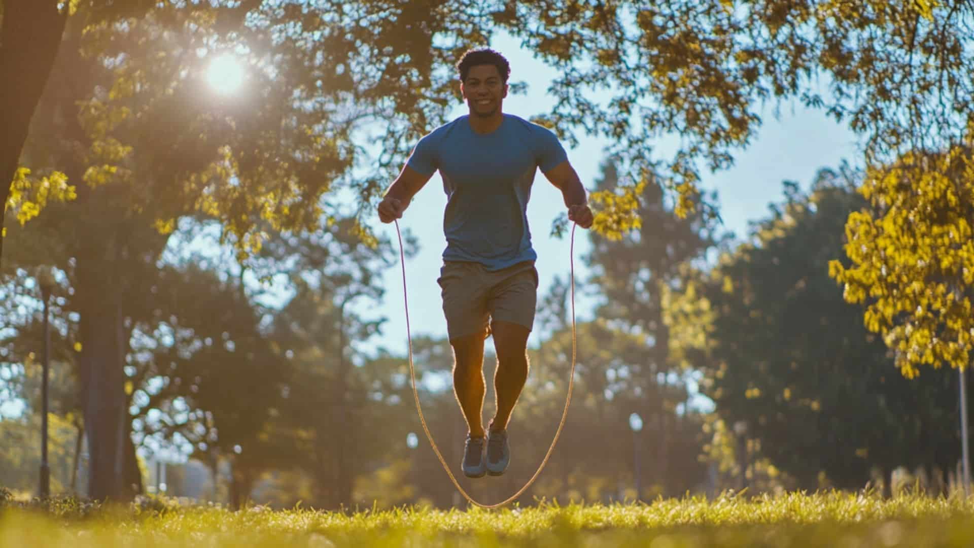 A Hispanic man jump roping in a vibrant park, surrounded by greenery, with sunlight filtering through trees. The man is in motion, showcasing his athleticism in a natural, peaceful setting. Prem